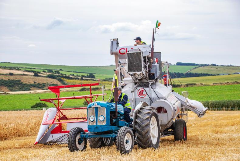 Combine harvester and old Fergie set off on separate end-to-end